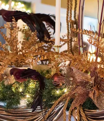 Photo shows Christmas decorations on a mantle at Government House