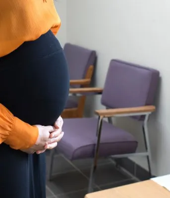 image of  a pregnant women in an office