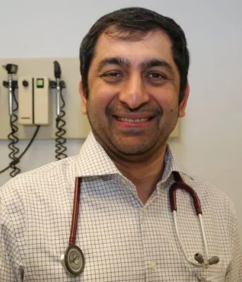Dr. Naser in clinical setting at Prince County Hospital