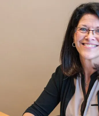 Myrtle MacPhee sits at the desk in her office. She is part of the team of mental health workers working to help Island seniors in need.