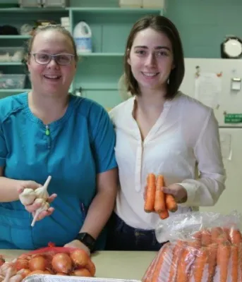 Hannah Hameline and Bev Campbell in the school kitchen 