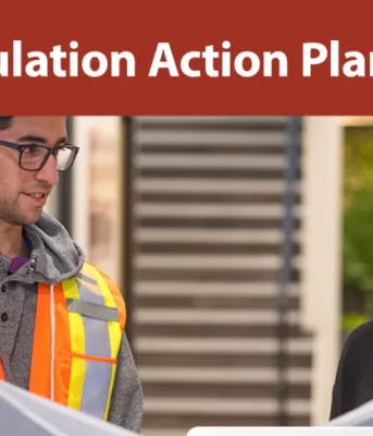 Image of two young professionals in an office setting with text: PEI Population Action Plan