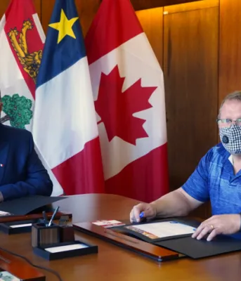 image of two people sitting at a table.