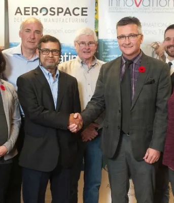 Dr. Subrata Chowdhury stands with Minister Heath MacDonald and a group of people from RPS Biologiques Inc.