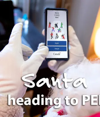 Image of Santa holding a cell phone with words on it