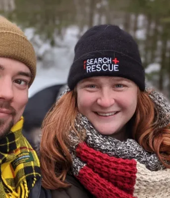 Image of two people shoulder to shoulder 