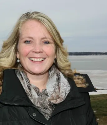 Tracey Gallant, from Cornwall, is shown in the foreground of a winter water-front scene