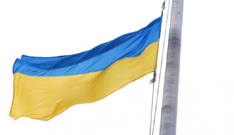 image of the Ukraine flag on a flag pole