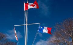 Image of PEI flag, Canada flag and Acadian flag at Government House