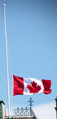 iStock image of Canada flag flying at half-mast